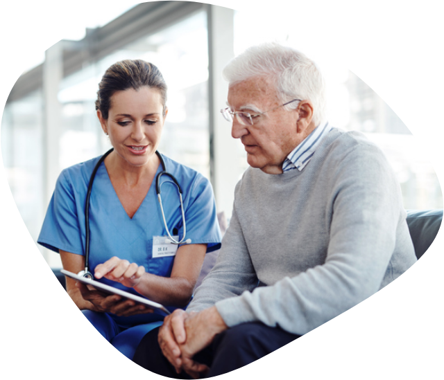 A female doctor showing test results to a middle-aged male patient