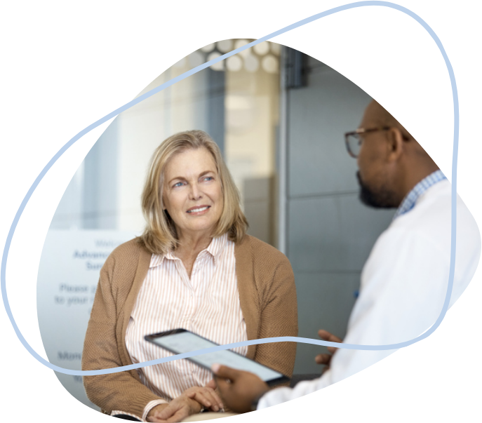 A middle-aged female patient listening to her doctor