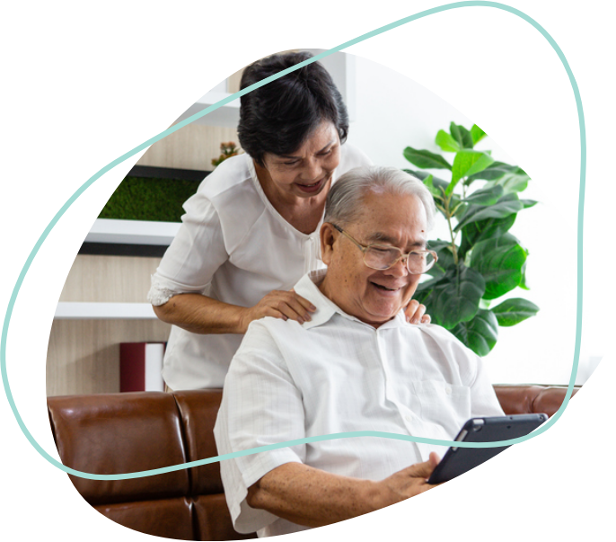 A man and woman looking at a laptop