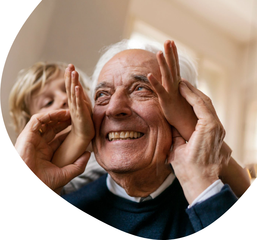 A man and his grandson holding their hands up