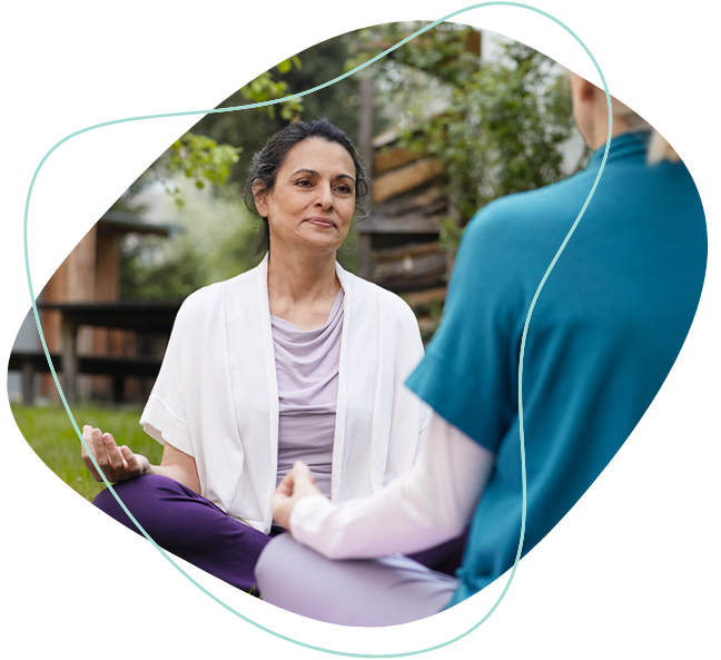 Two women meditating