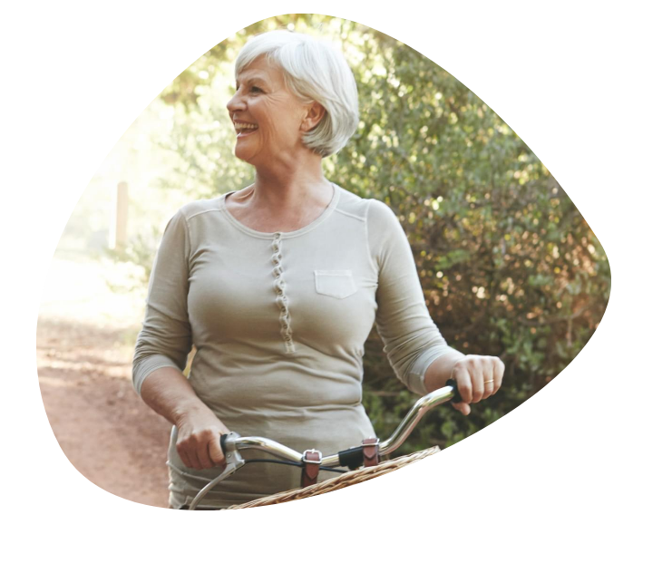 A woman smiling on her bike