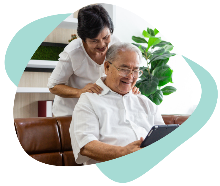 A husband showing his wife something on a tablet